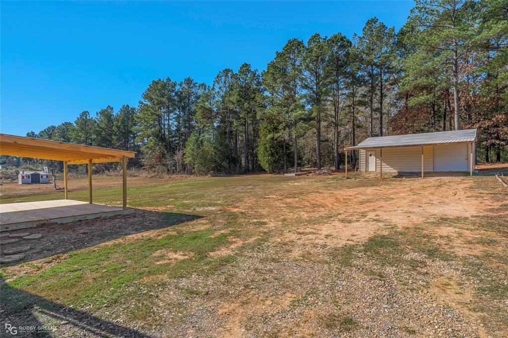 295 Cass Pvt Drive Gloster, LA 71030 - Photo 22 of 28 a view of a backyard with a garden