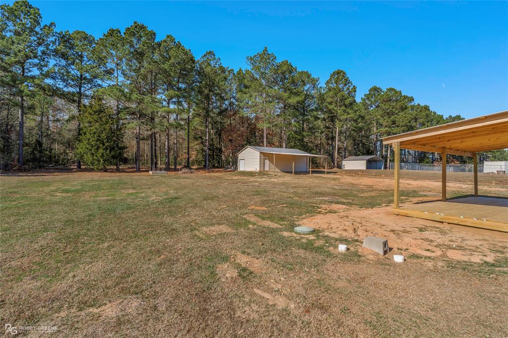 295 Cass Pvt Drive Gloster, LA 71030 - Photo 25 of 28 a view of a house with backyard and trees