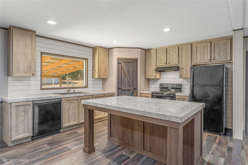 295 Cass Pvt Drive Gloster, LA 71030 - Photo 3 of 28 a kitchen with a stove a refrigerator and a sink