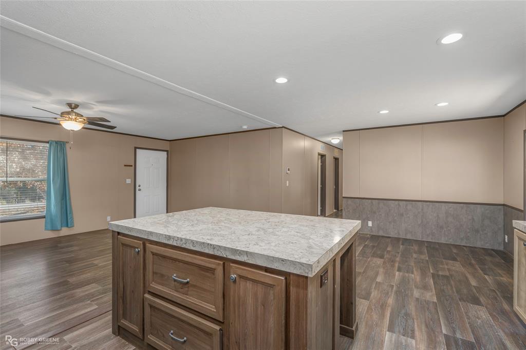 295 Cass Pvt Drive Gloster, LA 71030 - Photo 6 of 28 a kitchen with a sink and wooden floor