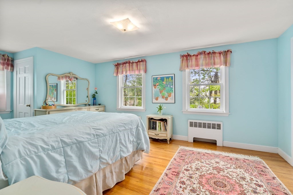 135 Tower Avenue Needham, MA 02494 - Photo 17 of 24 a spacious bedroom with a bed and window