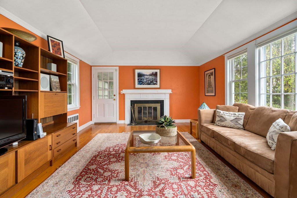 135 Tower Avenue Needham, MA 02494 - Photo 2 of 24 a living room with furniture fireplace and rug