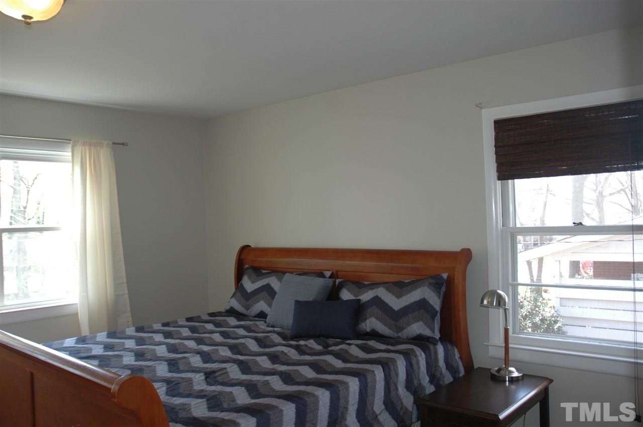 716 Currituck Drive Raleigh, NC 27609 - Photo 11 of 19 Features a walk in closet, remodeled bath, & hardwood floors.