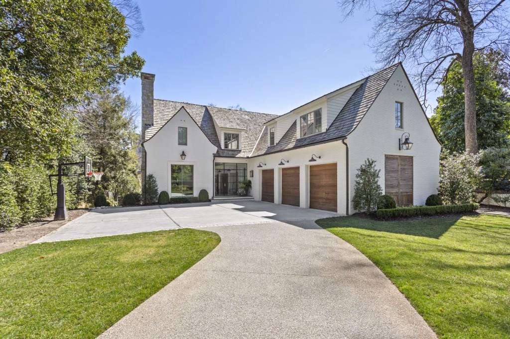 22 Cherokee Road Northwest Atlanta, GA 30305 - Photo 1 of 1 a front view of a house with a garden and yard