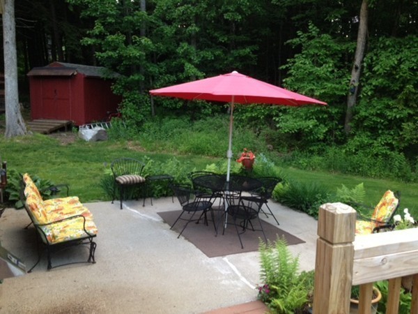 270 Main Road Chesterfield, MA 01012 - Photo 8 of 30 a view of a table and chairs under an umbrella in the garden