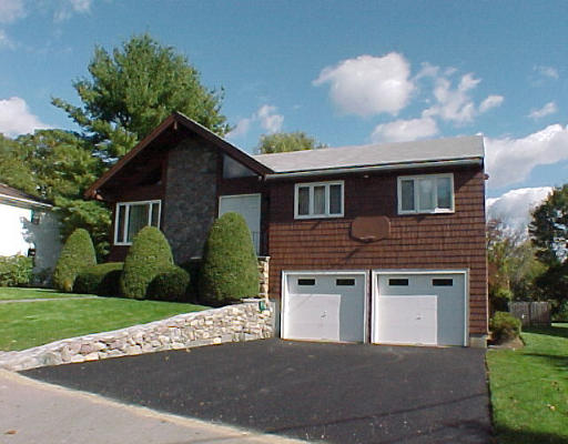 11 Lovett Road Newton, MA 02459 - Photo 1 of 3 a front view of a house with a yard