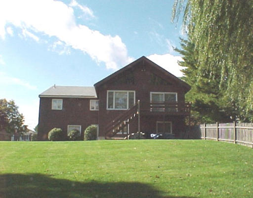 11 Lovett Road Newton, MA 02459 - Photo 2 of 3 a front view of a house with garden