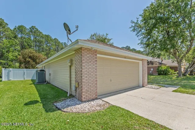 a view of a back yard of the house