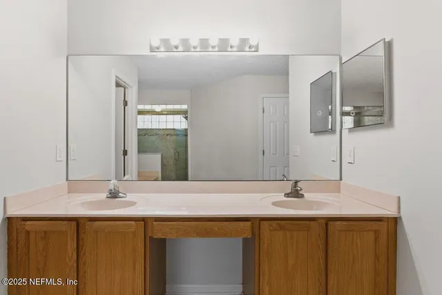 a bathroom with a sink and a mirror