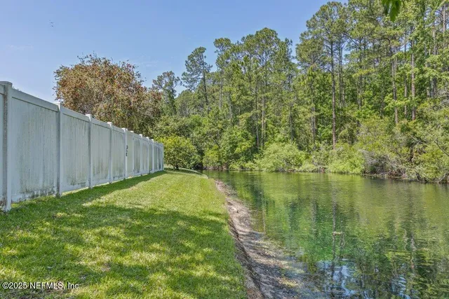 a view of a lake with a yard