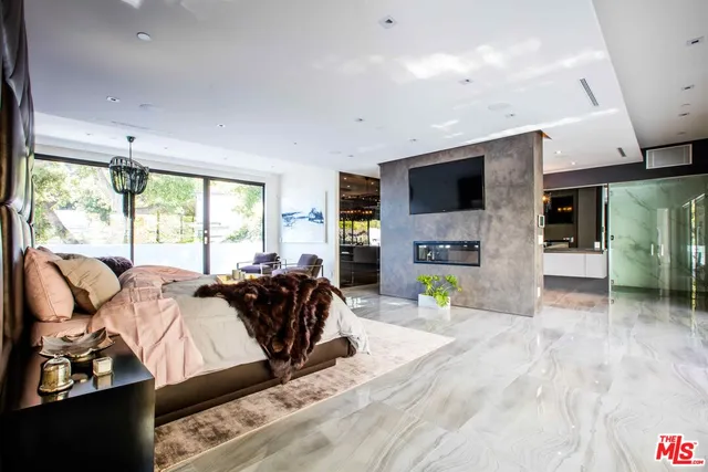 a living room with furniture and flat screen tv