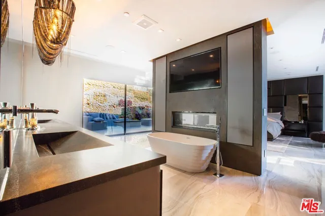 a kitchen with a sink and a large window