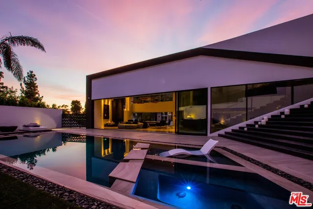 a view of swimming pool with outdoor seating
