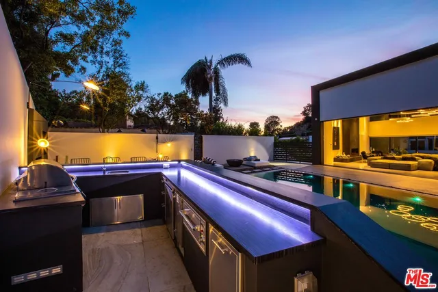 a view of swimming pool with outdoor seating