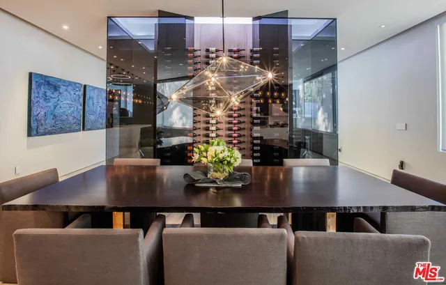 a view of a dining room with furniture and chandelier