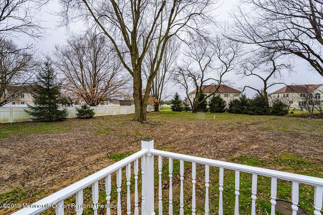 801 Adelphia Road Freehold, NJ 07728 - Photo 11 of 43 a view of a yard with wooden fence