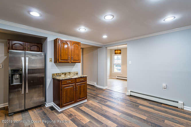 801 Adelphia Road Freehold, NJ 07728 - Photo 13 of 43 a kitchen with stainless steel appliances granite countertop a refrigerator and a sink