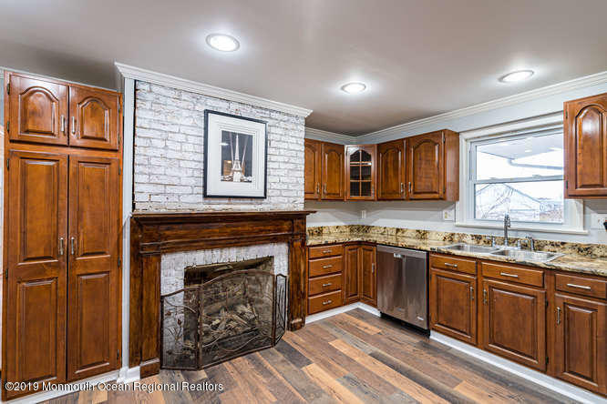 801 Adelphia Road Freehold, NJ 07728 - Photo 14 of 43 a kitchen with stainless steel appliances granite countertop a stove sink and cabinets