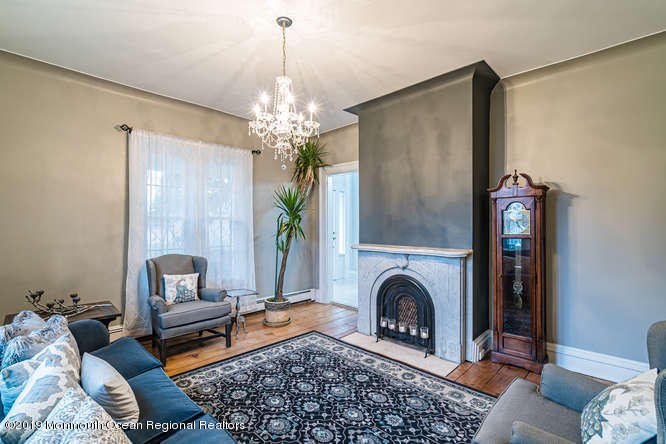 801 Adelphia Road Freehold, NJ 07728 - Photo 23 of 43 a living room with furniture and a fireplace