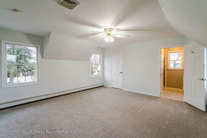 801 Adelphia Road Freehold, NJ 07728 - Photo 34 of 43 an empty room with windows and fan
