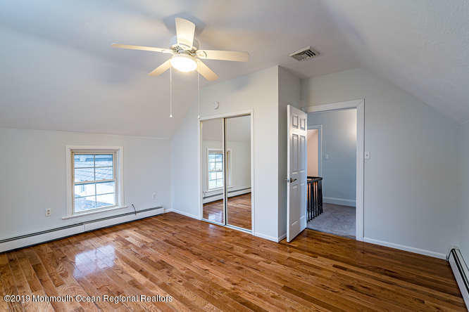 801 Adelphia Road Freehold, NJ 07728 - Photo 40 of 43 wooden floor in an empty room with a window
