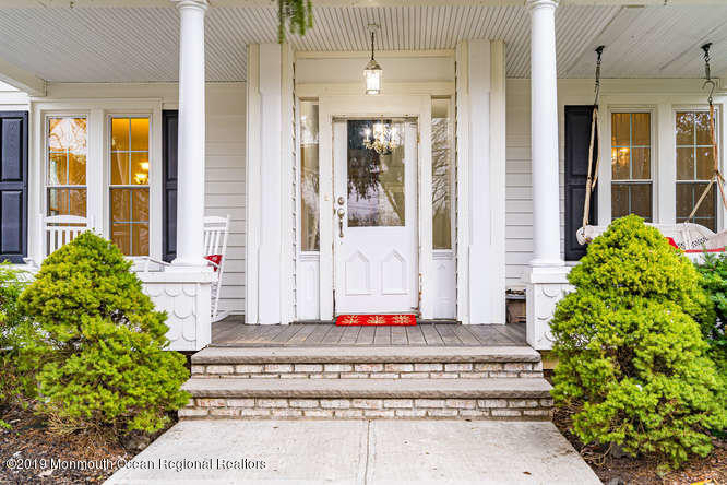 801 Adelphia Road Freehold, NJ 07728 - Photo 5 of 43 a front view of a house with a garden