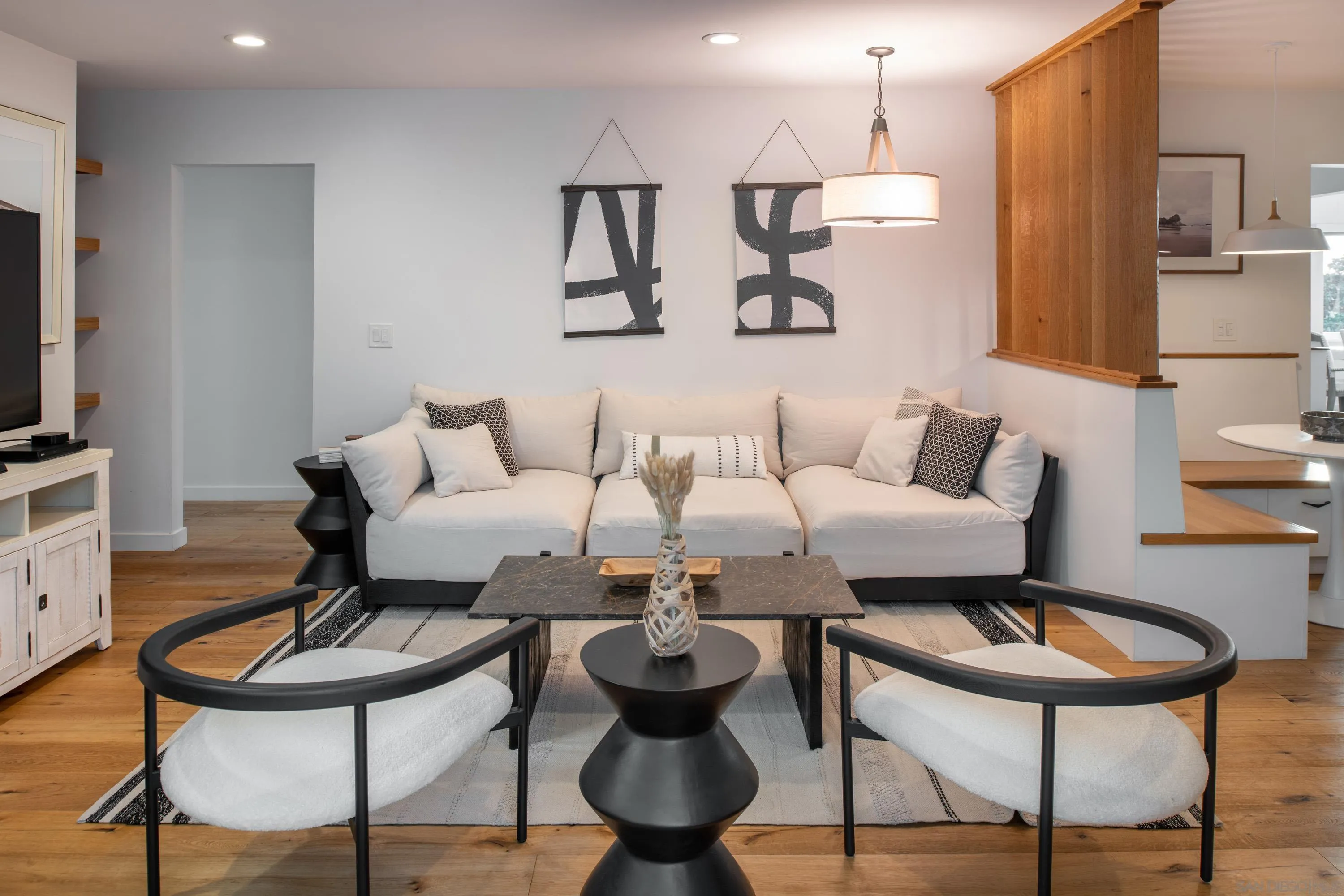 6529 Manana Place La Jolla, CA 92037 - Photo 12 of 36 a living room with furniture and a chandelier