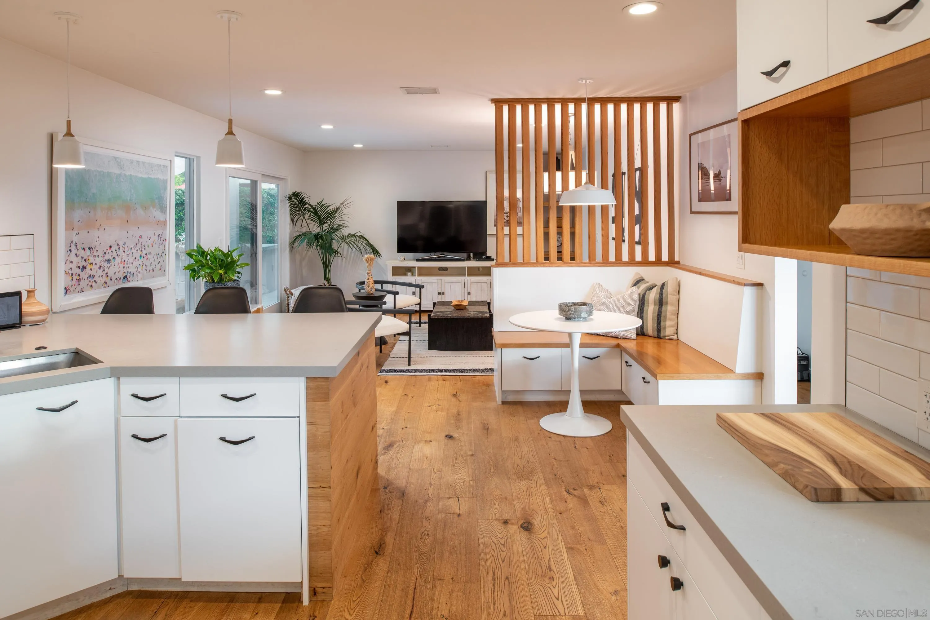 6529 Manana Place La Jolla, CA 92037 - Photo 16 of 36 a kitchen with stainless steel appliances granite countertop a sink stove and cabinets
