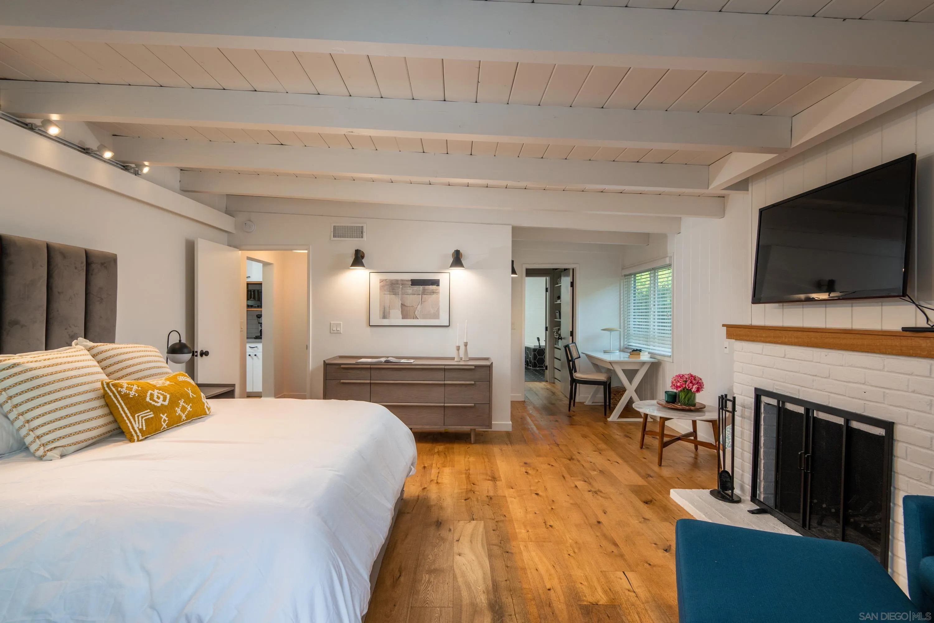 6529 Manana Place La Jolla, CA 92037 - Photo 18 of 36 a bedroom with a bed and a flat screen tv