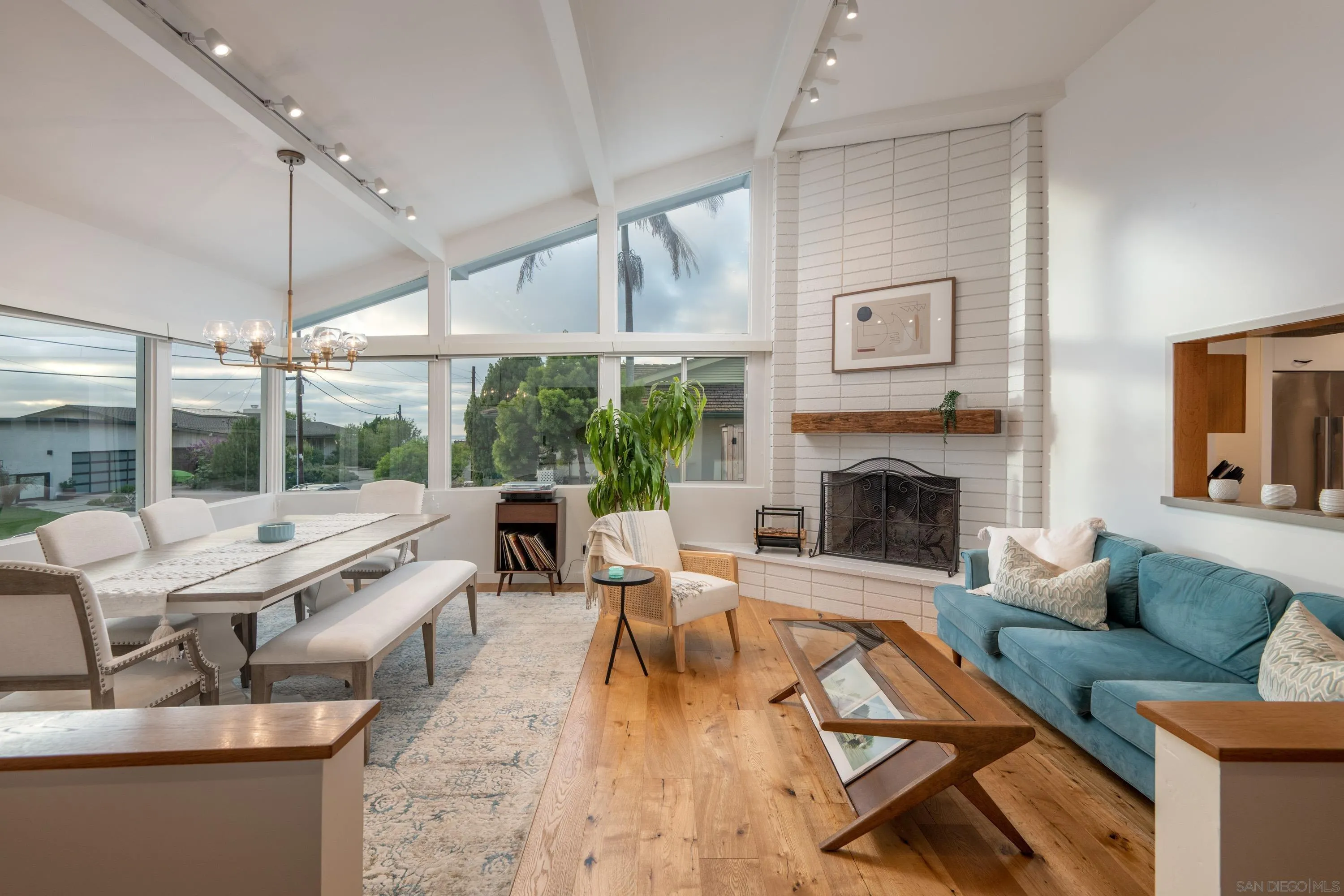6529 Manana Place La Jolla, CA 92037 - Photo 5 of 36 a living room with furniture large window and a fireplace