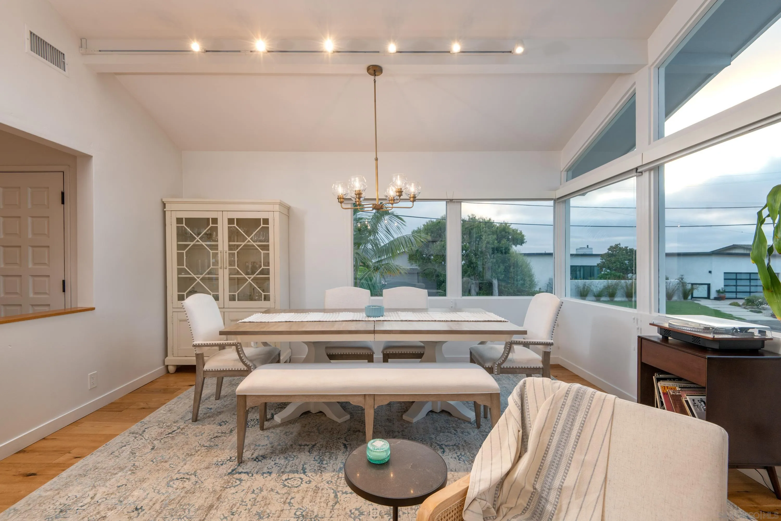 6529 Manana Place La Jolla, CA 92037 - Photo 7 of 36 a living room with furniture a table and chairs