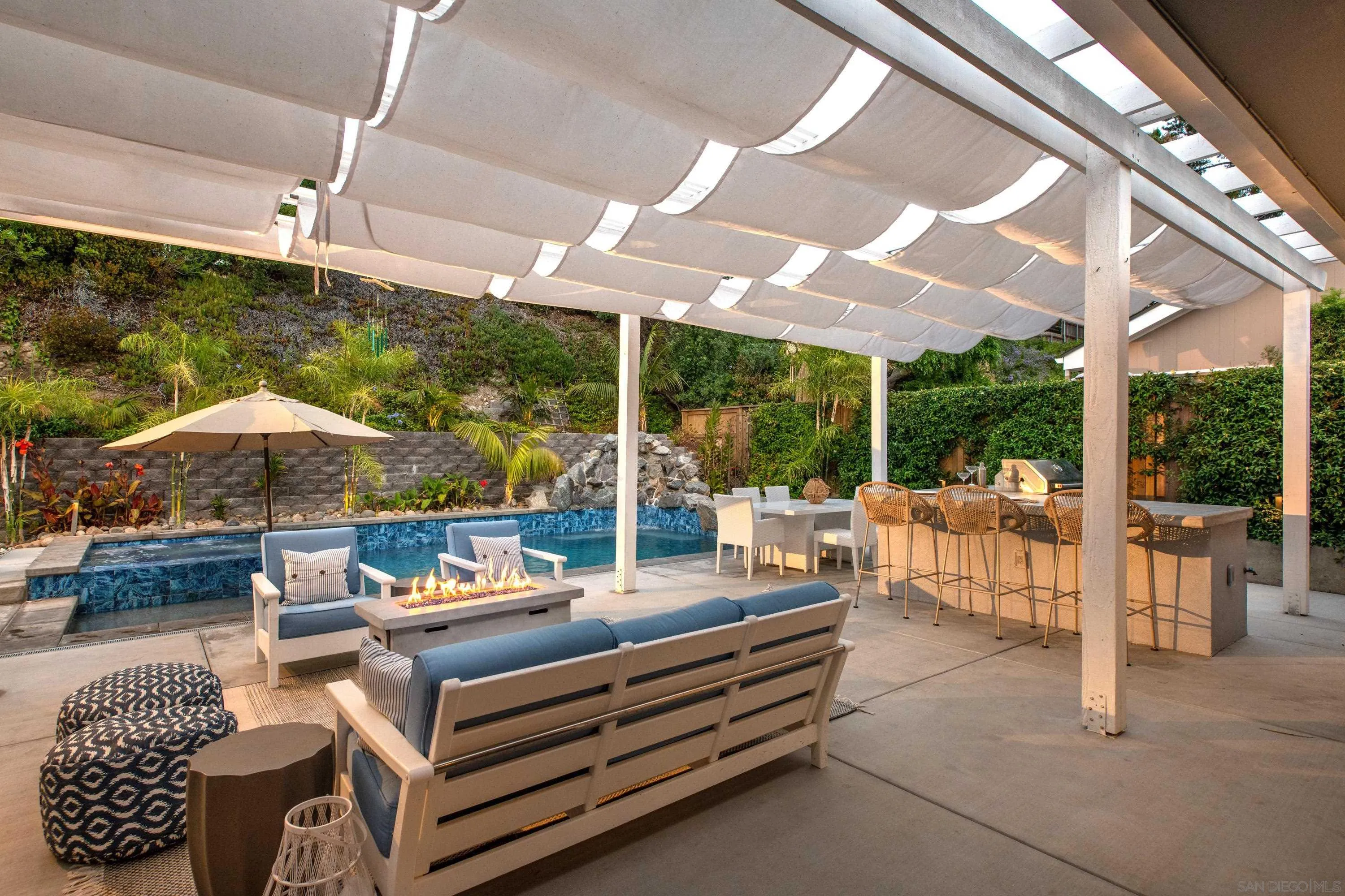 6529 Manana Place La Jolla, CA 92037 - Photo 9 of 36 a outdoor space with patio lots of furniture and umbrella