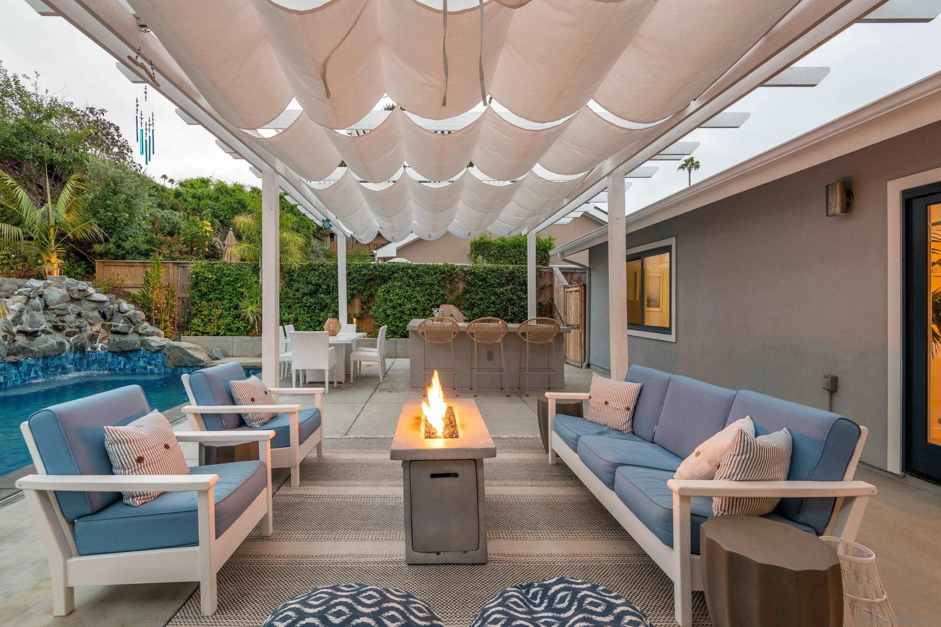 6529 Manana Place La Jolla, CA 92037 - Photo 10 of 36 a outdoor space with patio the couches and a dining table with garden view