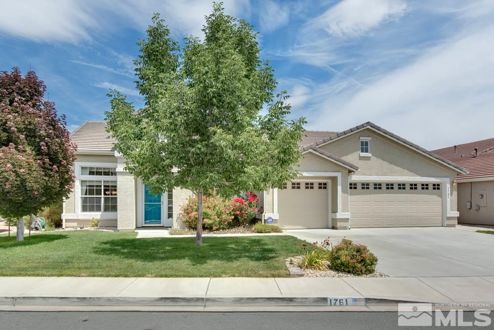 1761 Colavita Way Reno, NV 89521 - Photo 1 of 1 a front view of a house with a yard and a garage