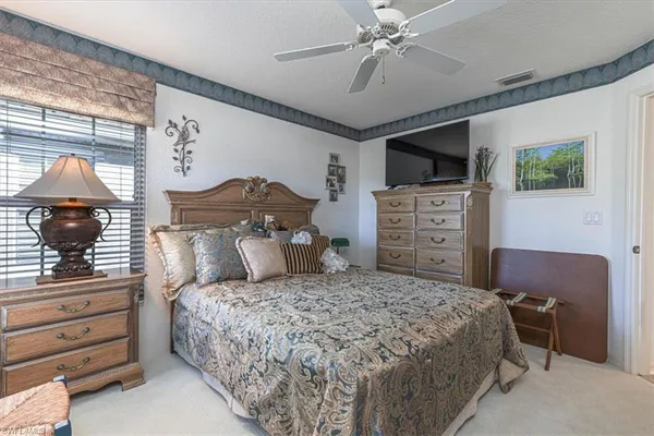a bedroom with a bed and furniture