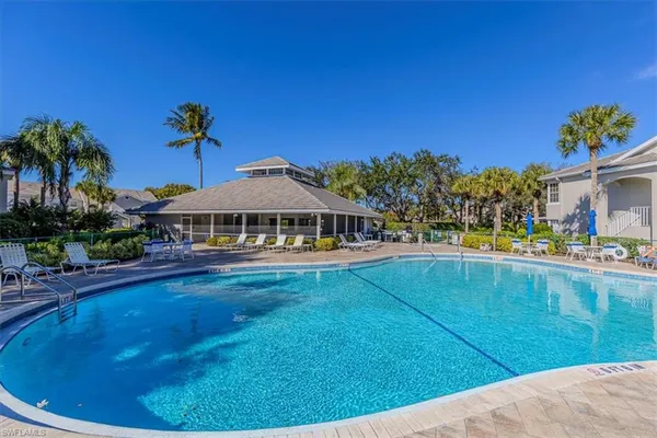 a view of swimming pool from a lounge chair