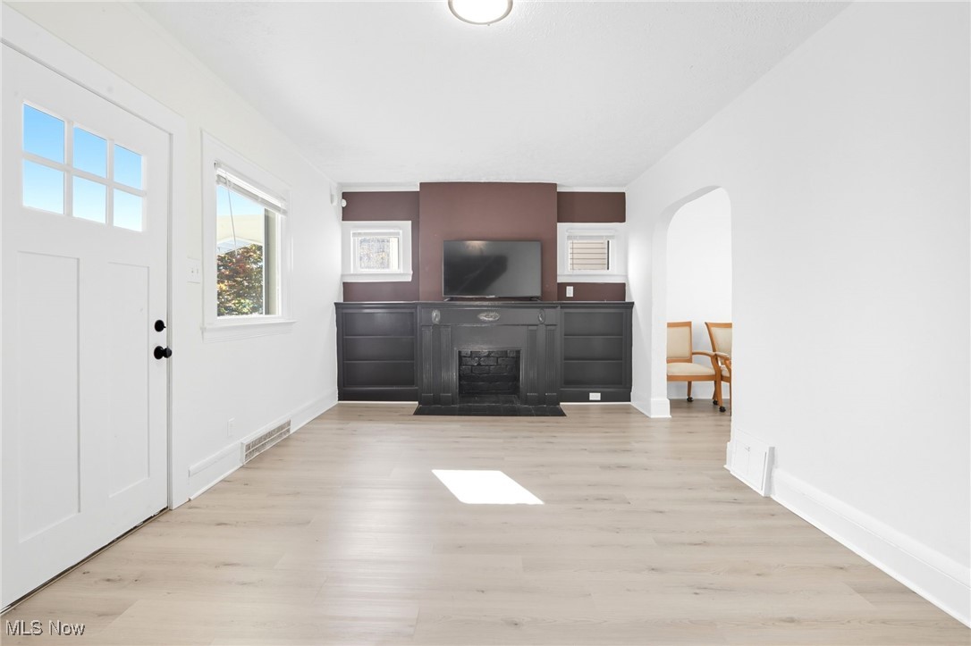 3359 Altamont Road Cleveland, OH 44118 - Photo 14 of 31 Foyer featuring light wood finished floors and arched walkways