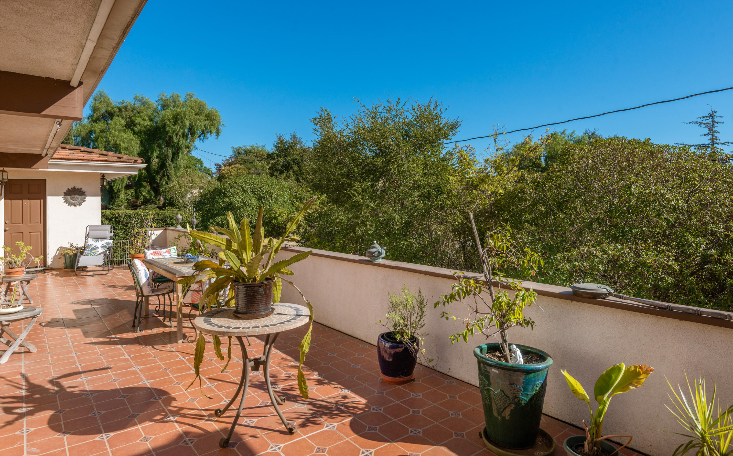 Undisclosed Address Santa Barbara, CA 93110 - Photo 11 of 12 a view of a patio with table and chairs and potted plants