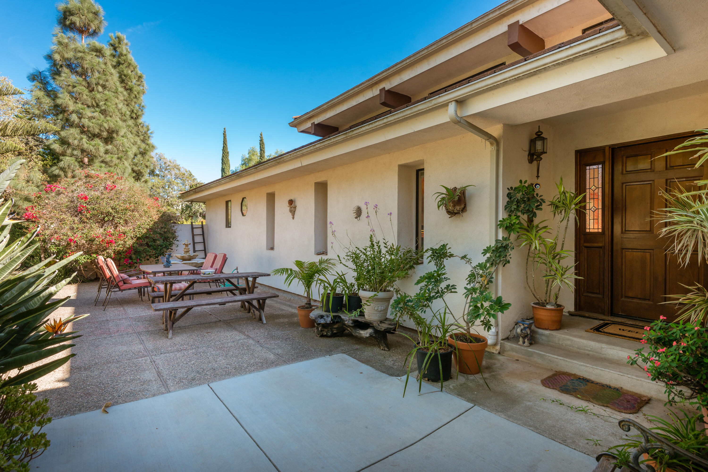 Undisclosed Address Santa Barbara, CA 93110 - Photo 2 of 12 a backyard of a house with outdoor seating