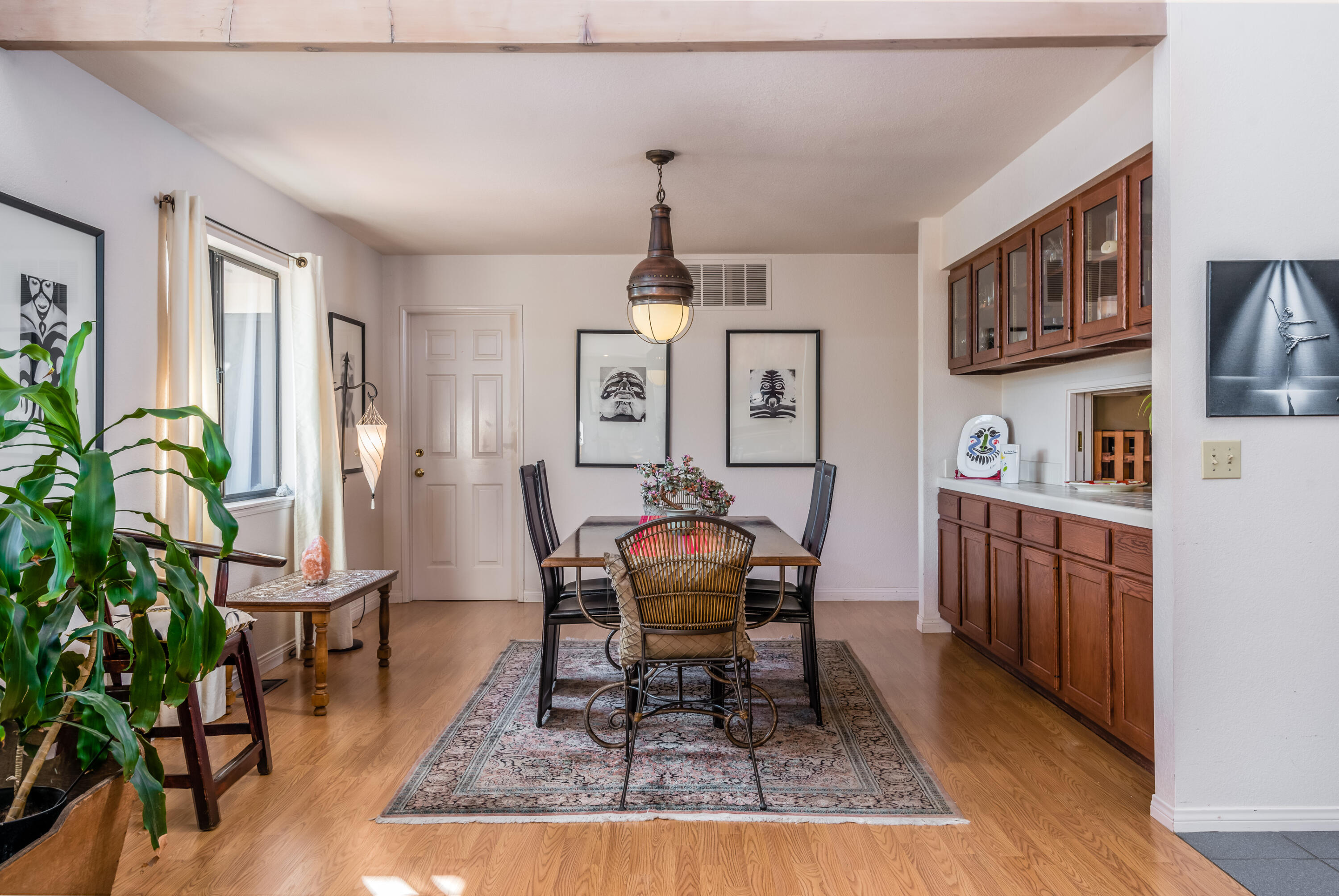 Undisclosed Address Santa Barbara, CA 93110 - Photo 6 of 12 a dining room with furniture potted plants and wooden floor