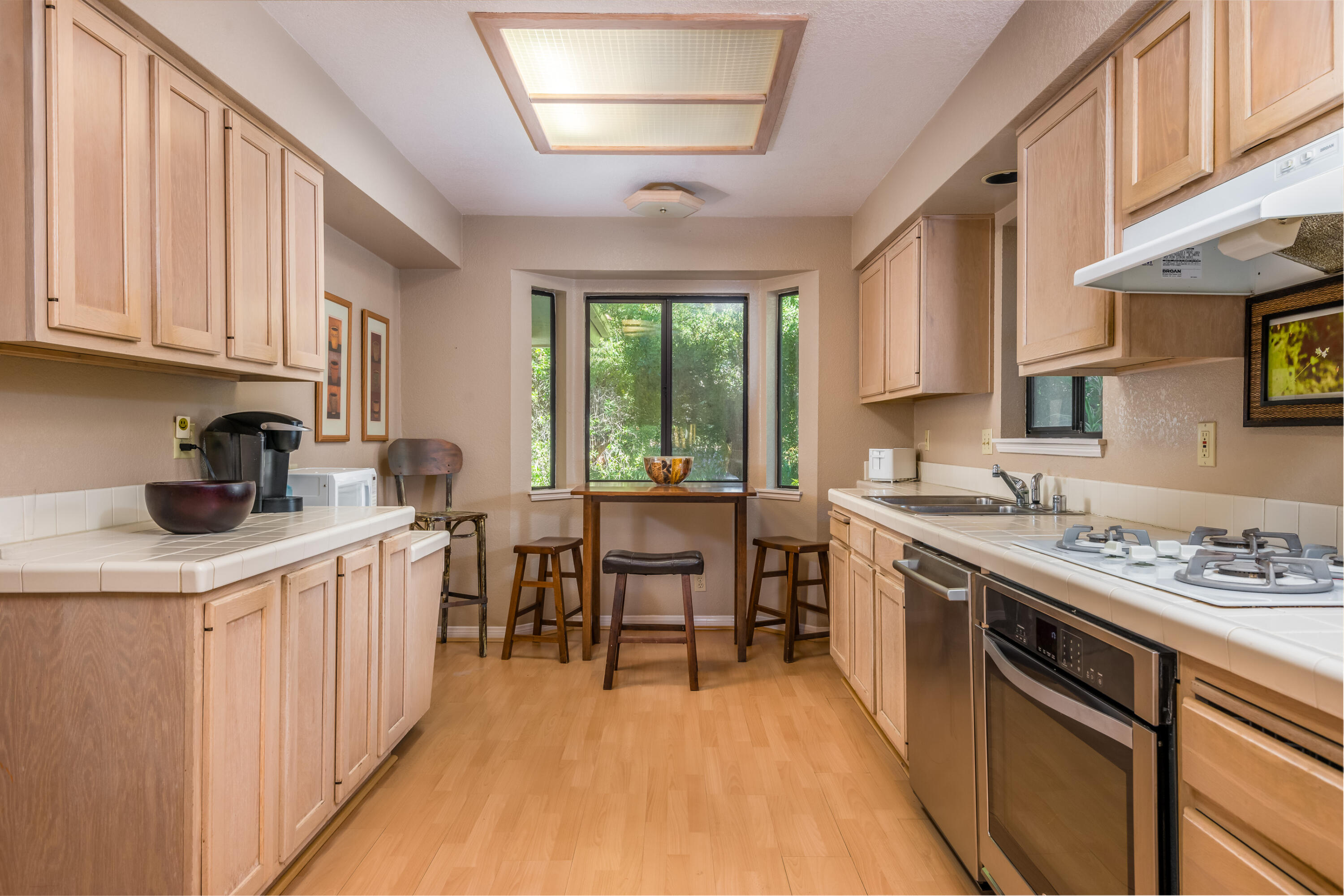 Undisclosed Address Santa Barbara, CA 93110 - Photo 7 of 12 a kitchen with stainless steel appliances granite countertop a stove a sink dishwasher and a refrigerator