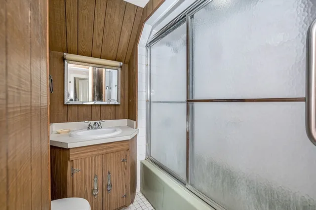 a bathroom with a sink and mirror