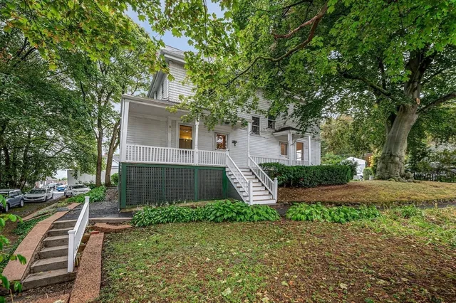 a front view of a house with garden