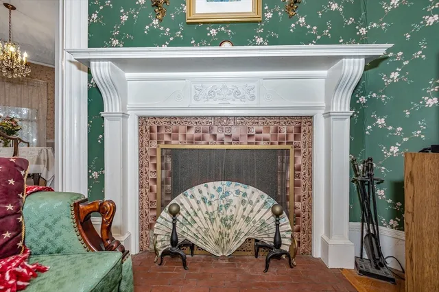 a view of livingroom with furniture and a fireplace