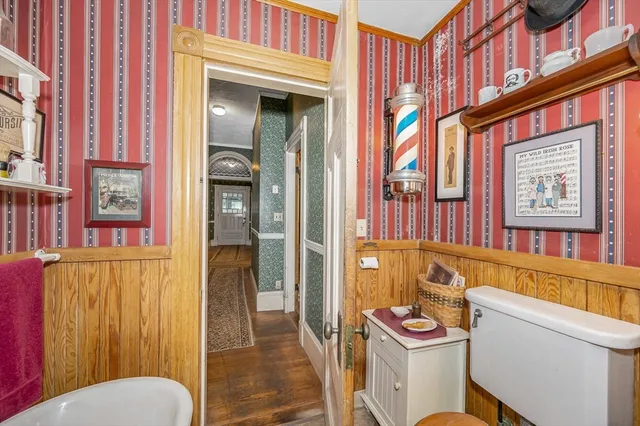 a bathroom with a sink a toilet and tub