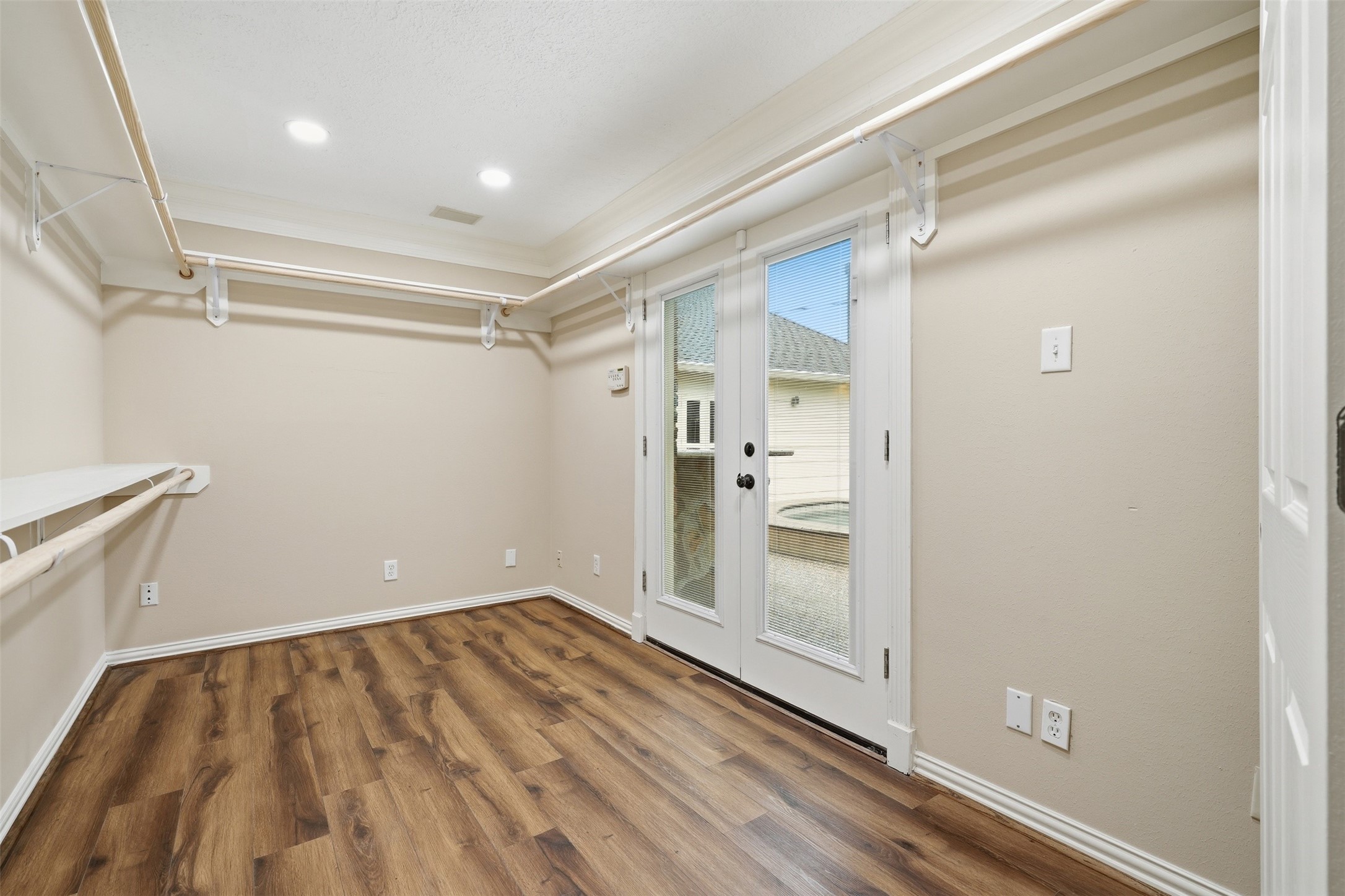 8310 Mentmore Drive Spring, TX 77379 - Photo 29 of 47 An additional oversized walk-in closet provides even more storage, making organization effortless. The is off of the primary bedroom and has double doors that lead out to the backyard.