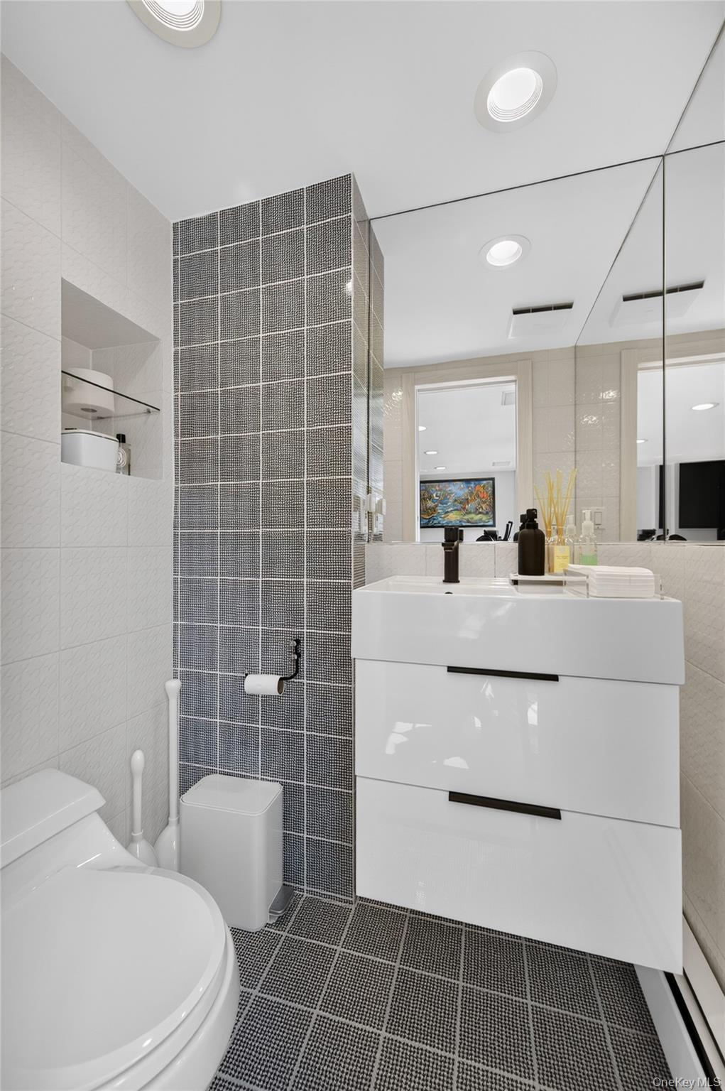 11 Sunbeam Road Syosset, NY 11791 - Photo 19 of 28 Modern bathroom featuring a floating vanity with integrated sink, recessed lighting