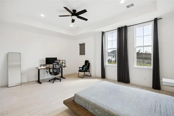 a bed room with a bed and a window