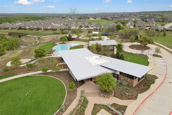 an aerial view of a house with a lake view