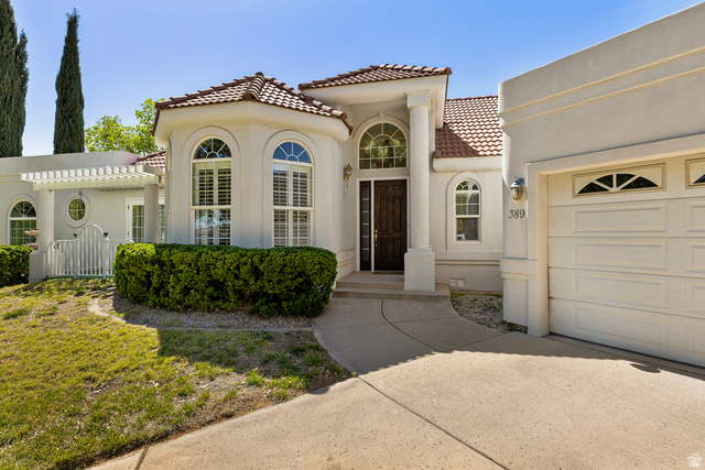 389 North Main Street St. George, UT 84770 - Photo 8 of 44 Mediterranean / spanish-style home with a tiled roof, stucco siding, an attached garage, and concrete driveway